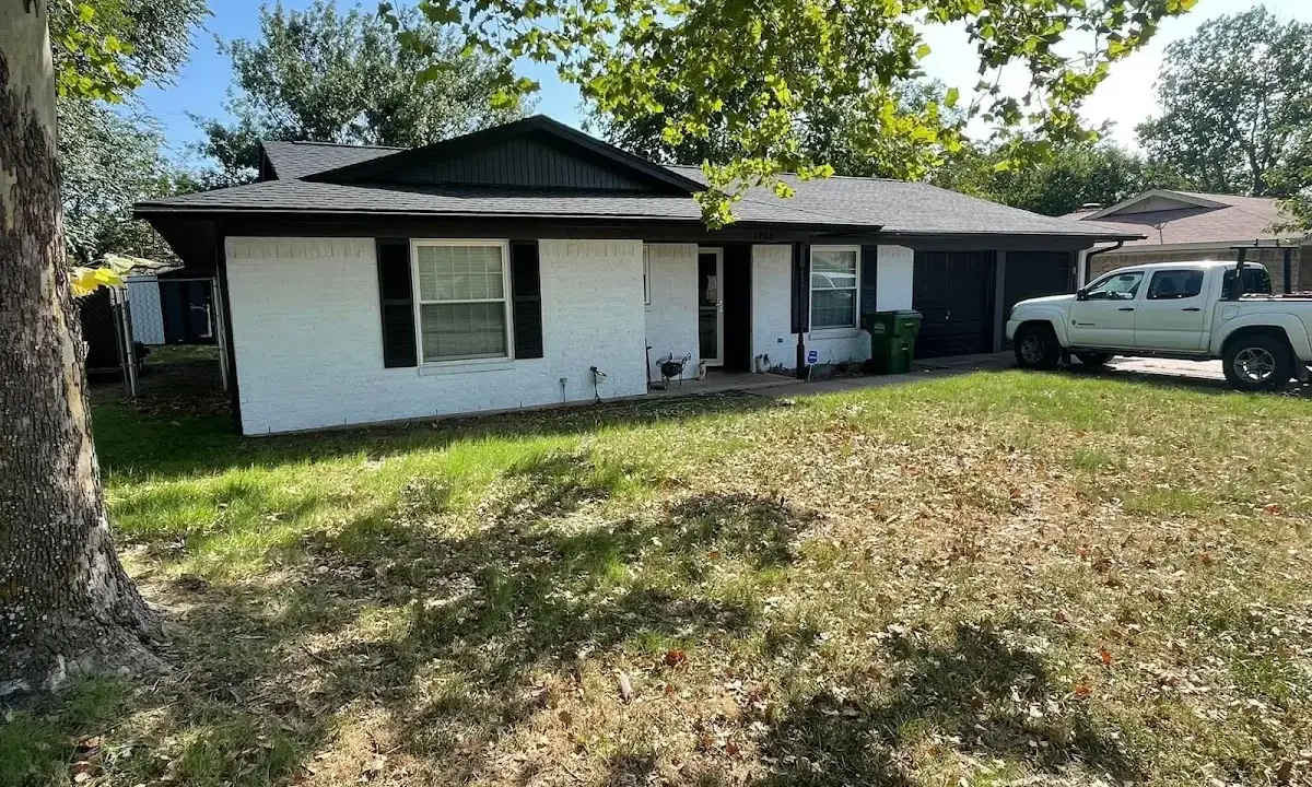 Professional roofing crew working on a residential roof in Ellenton